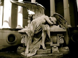 Weeping Angel statuary in Cementiri del Sud-Oest on Montjuïc, Barcelona.